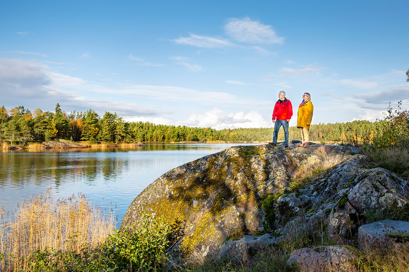 Two people watching the sea during autumn in the archipelago